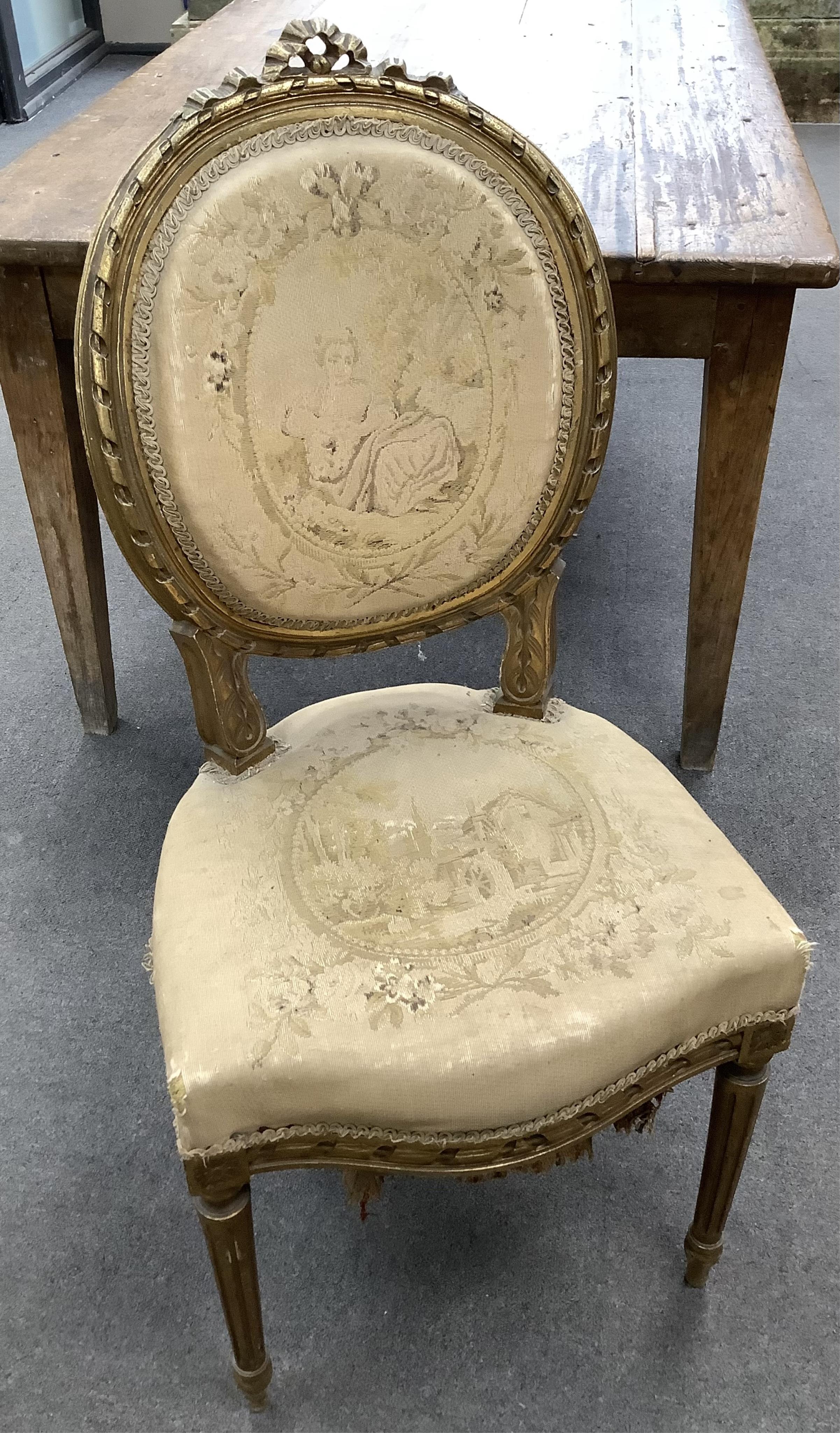 A Louis XVI style giltwood and composition three piece salon suite with tapestry upholstery, settee width 120cm, depth 54cm, height 102cm. Condition - fair